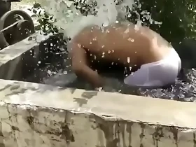 Sexy Indian guy takes outdoor bath